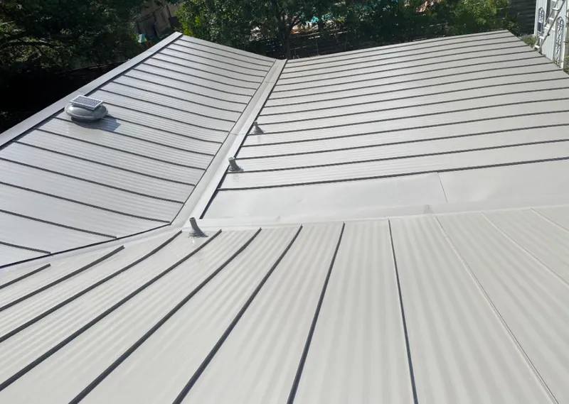Solar attic fan installed on a metal roof for Roof Ventilation in Parlier